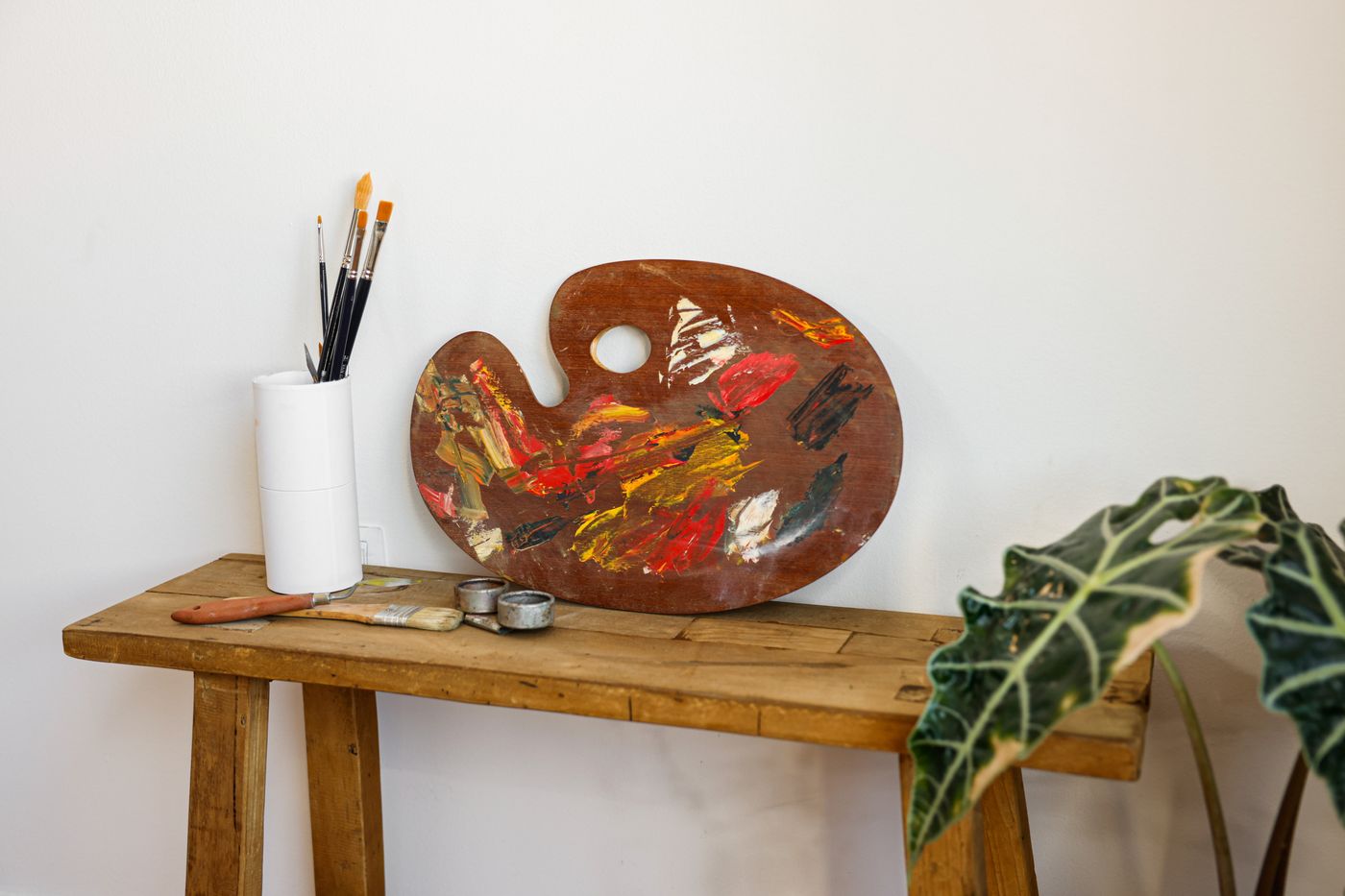 An artist's workspace with brushes and paints